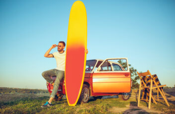 The surfboard, car, man.