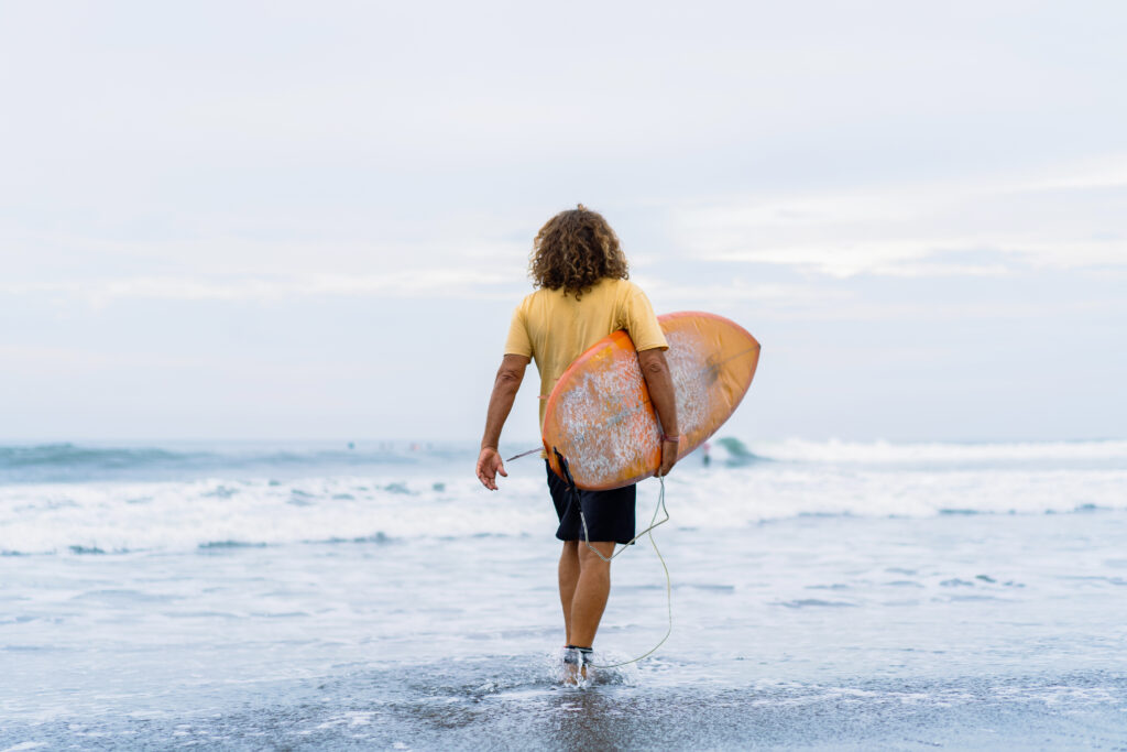 Riding the Waves: A Comprehensive Guide for Beginner Surfers - Surfing